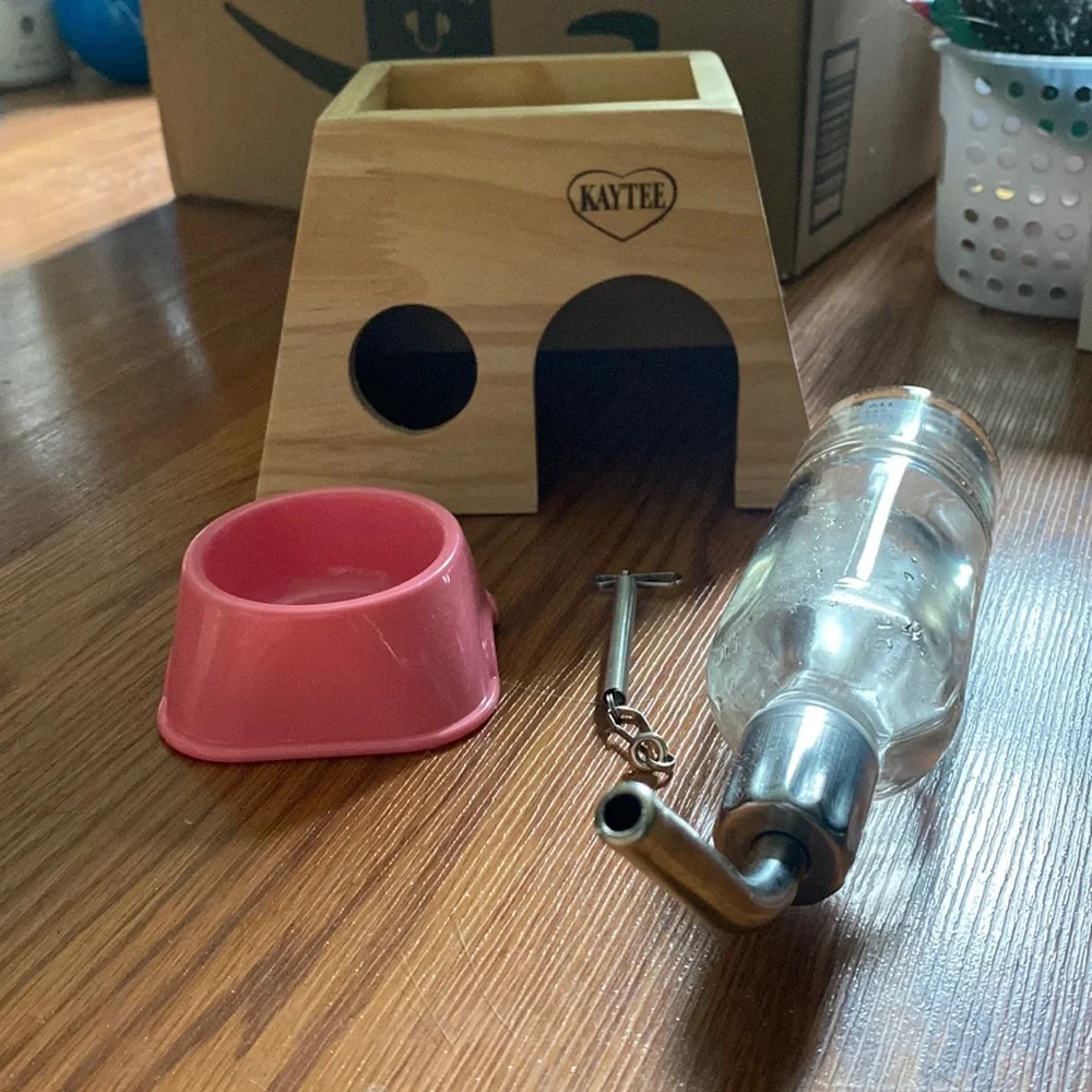 Hamster hut, water bottle, and food bowl